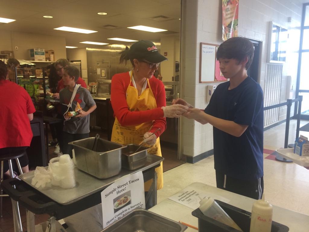 Serving lunch in a school cafeteria